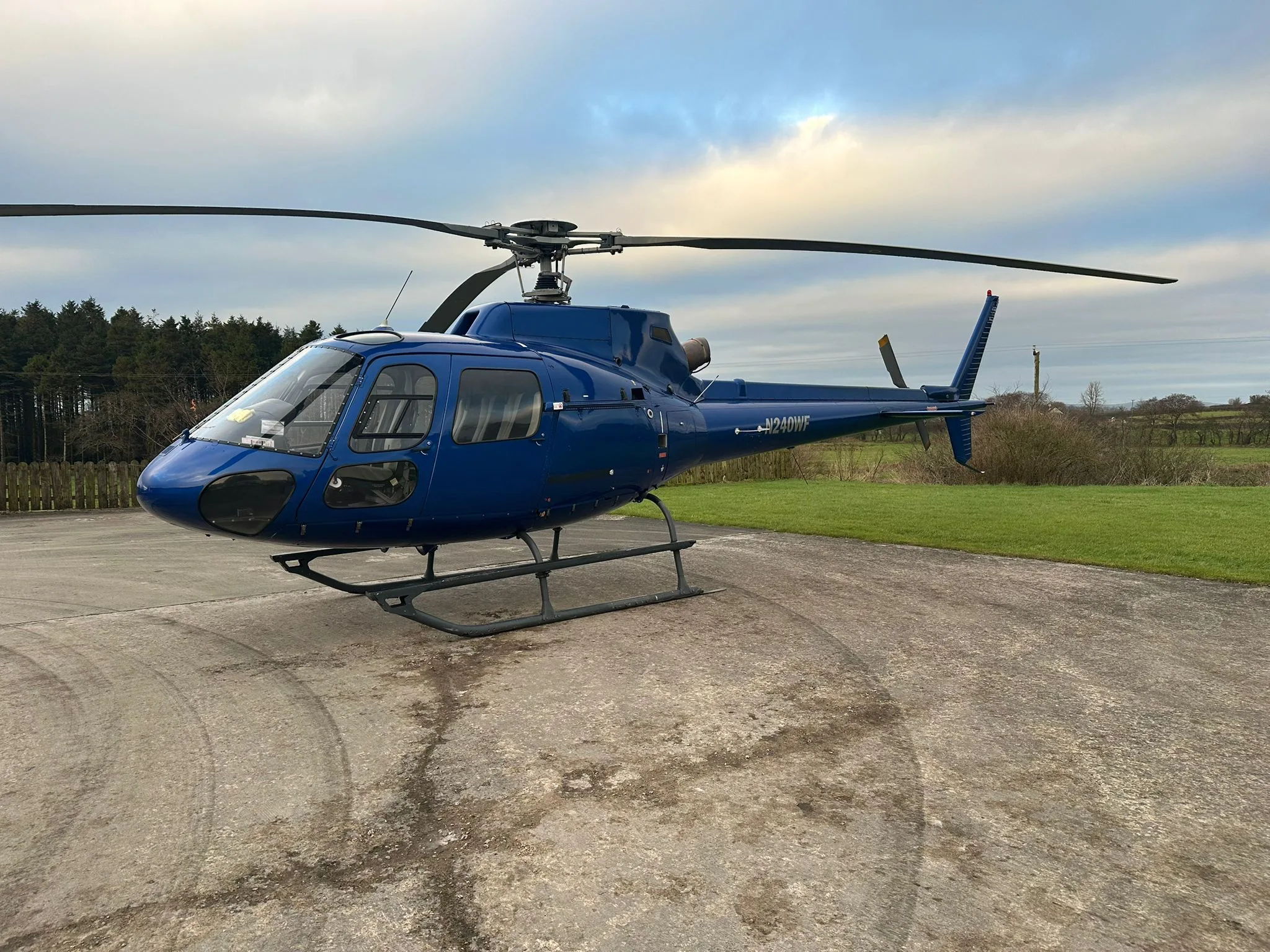 View of the helicopter cabin with seats and cockpit area.