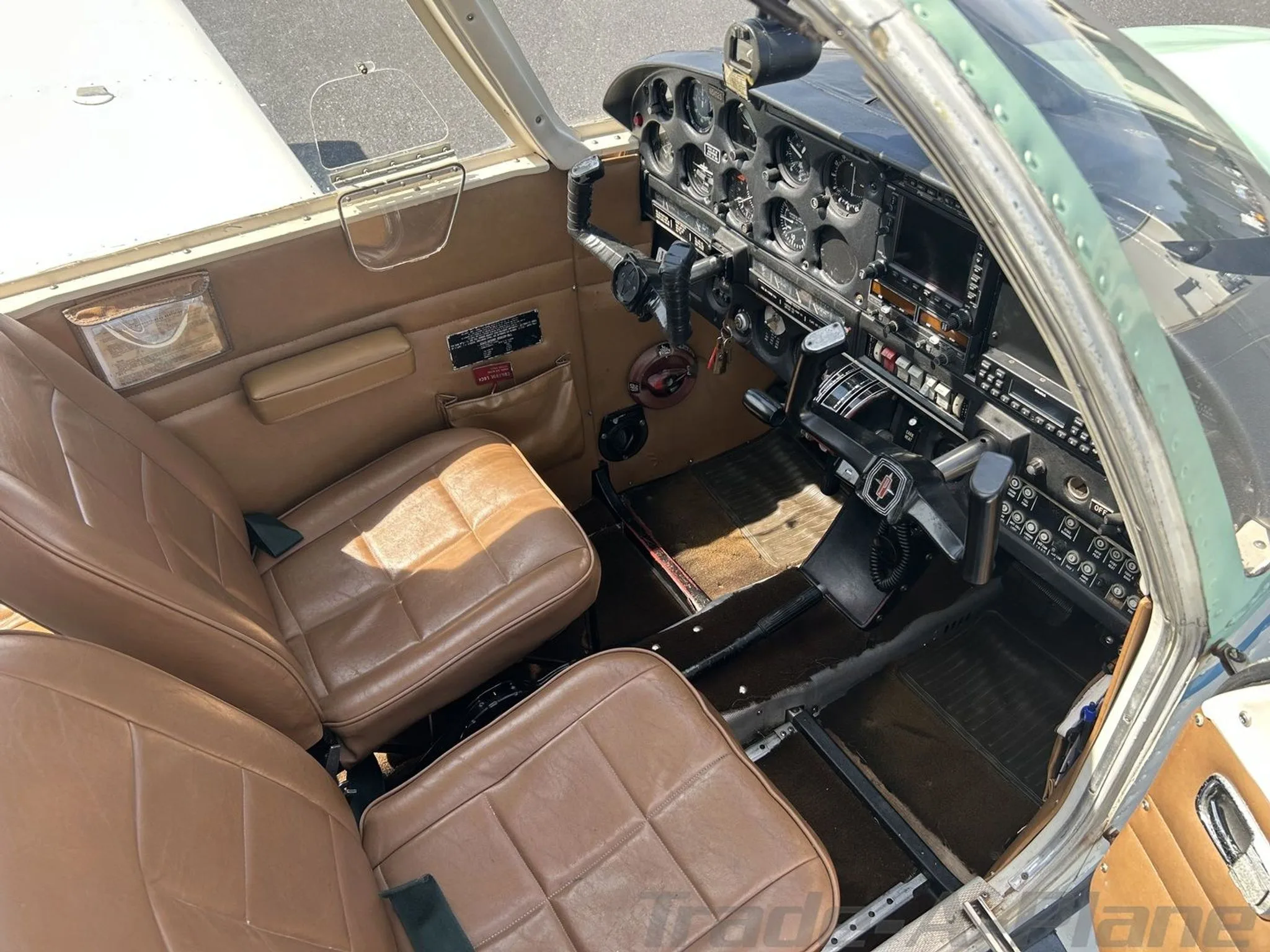 Interior view of the cockpit with pilot seats.