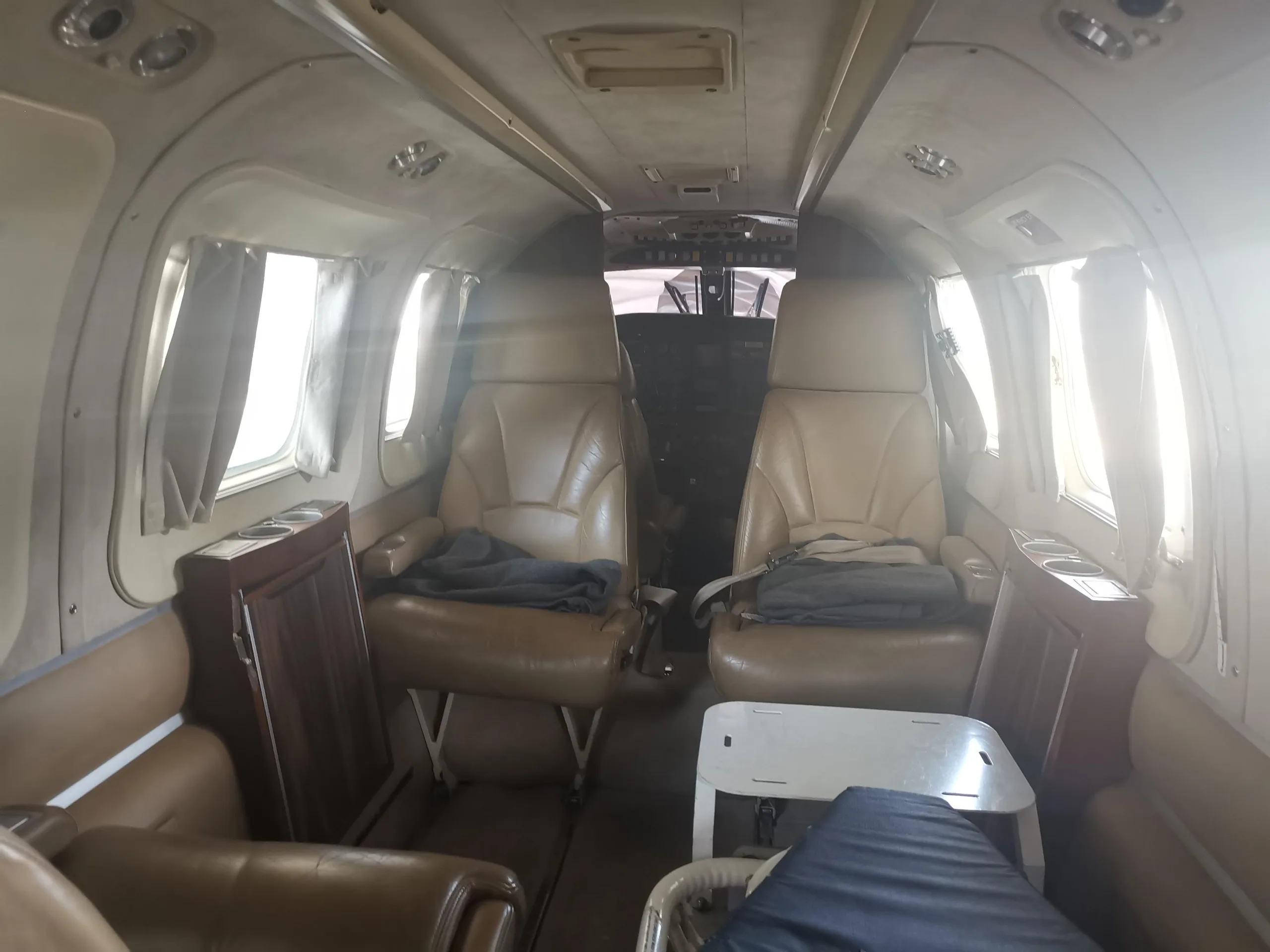 Interior view of the aircraft cabin with leather seats.