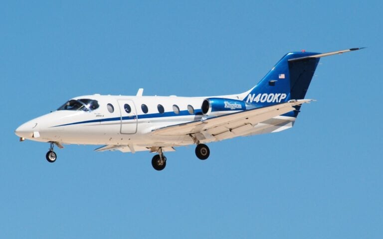 Falcon 2000EX taking off from a runway.