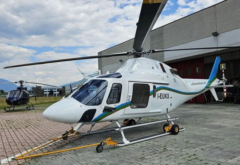 AgustaWestland AW109 helicopter with registration I-EUKX on the ramp.