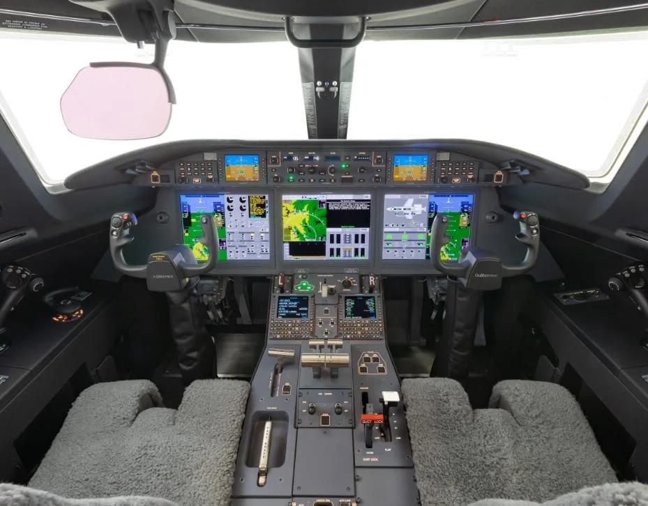 View of the aircraft cockpit with instrument panel and controls.