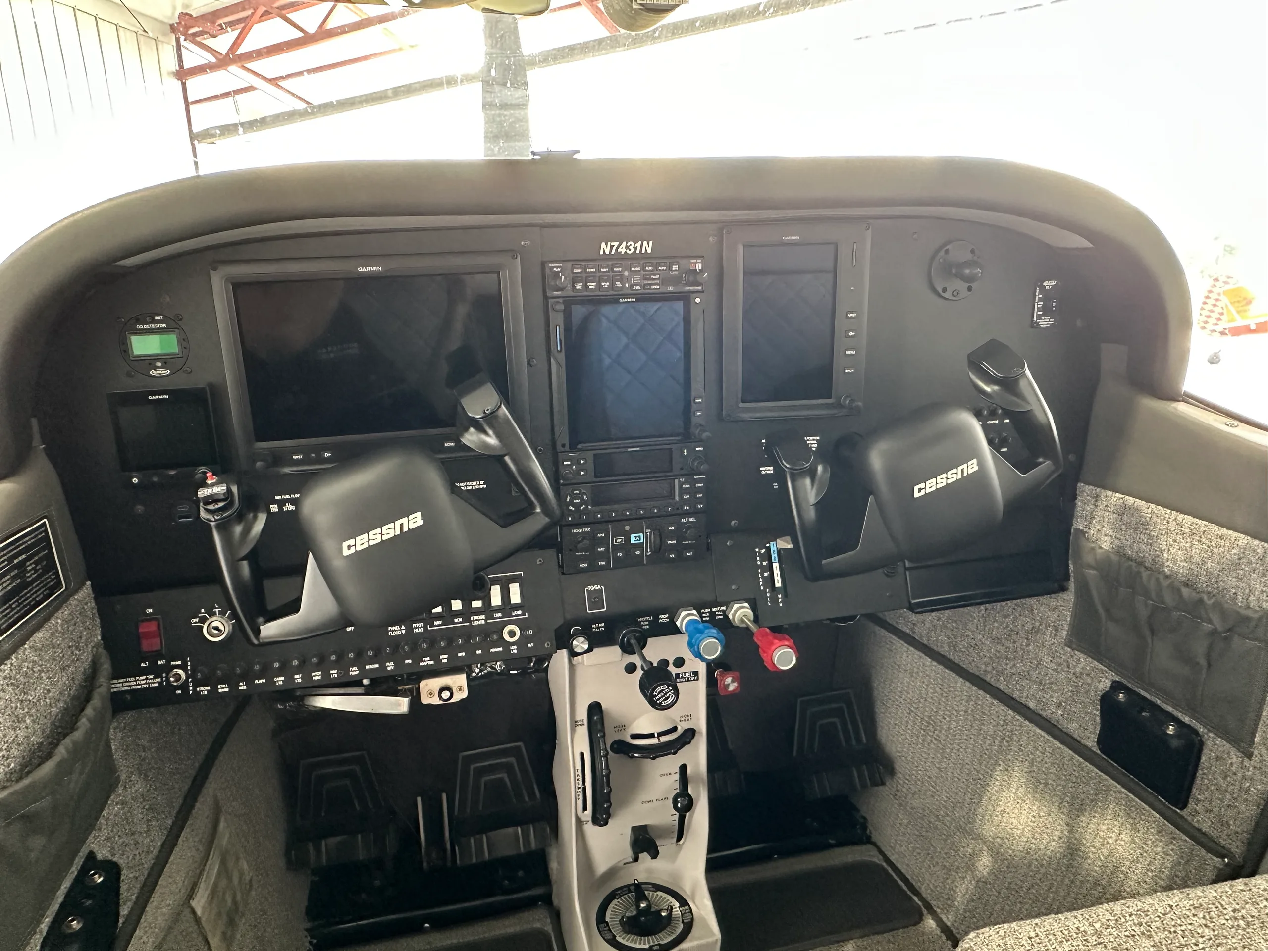 Detailed view of the Cessna 182 Skylane cockpit instrument panel.
