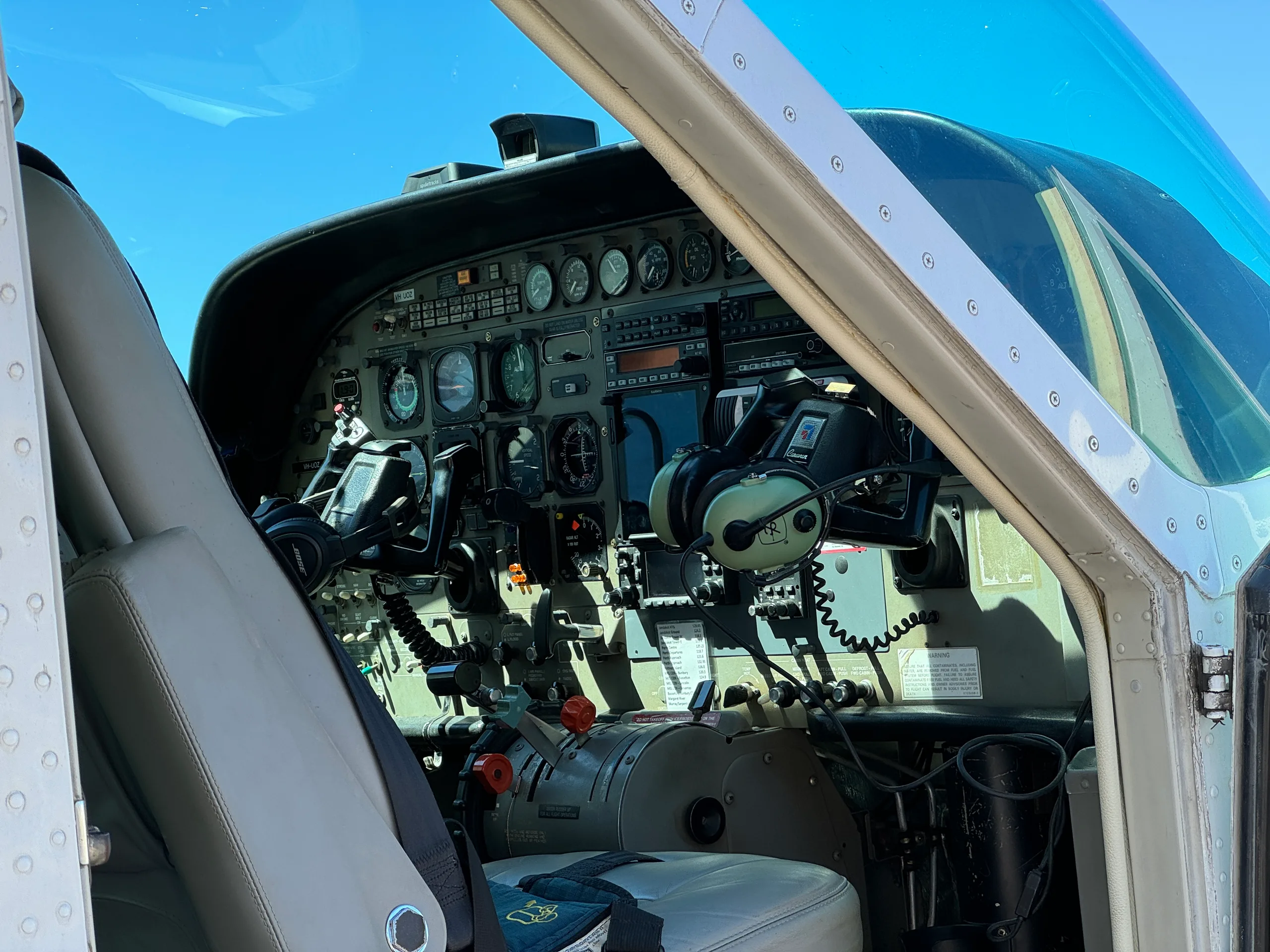 View of the aircraft cockpit with instrument panel and controls.