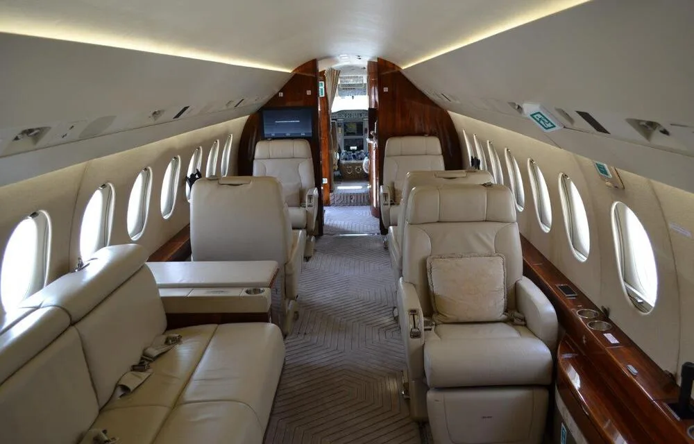 Another view of the cabin showcasing seating and decor.