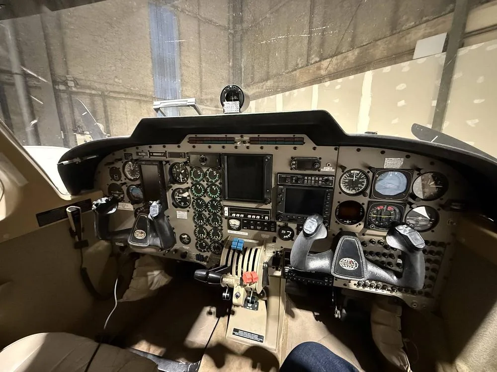 Detailed view of the aircraft's cockpit with the instrument panel and dual yokes.