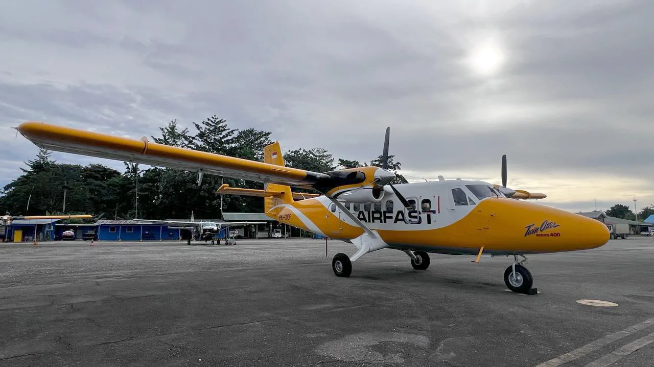 PK-OCF Twin Otter parked on the tarmac.