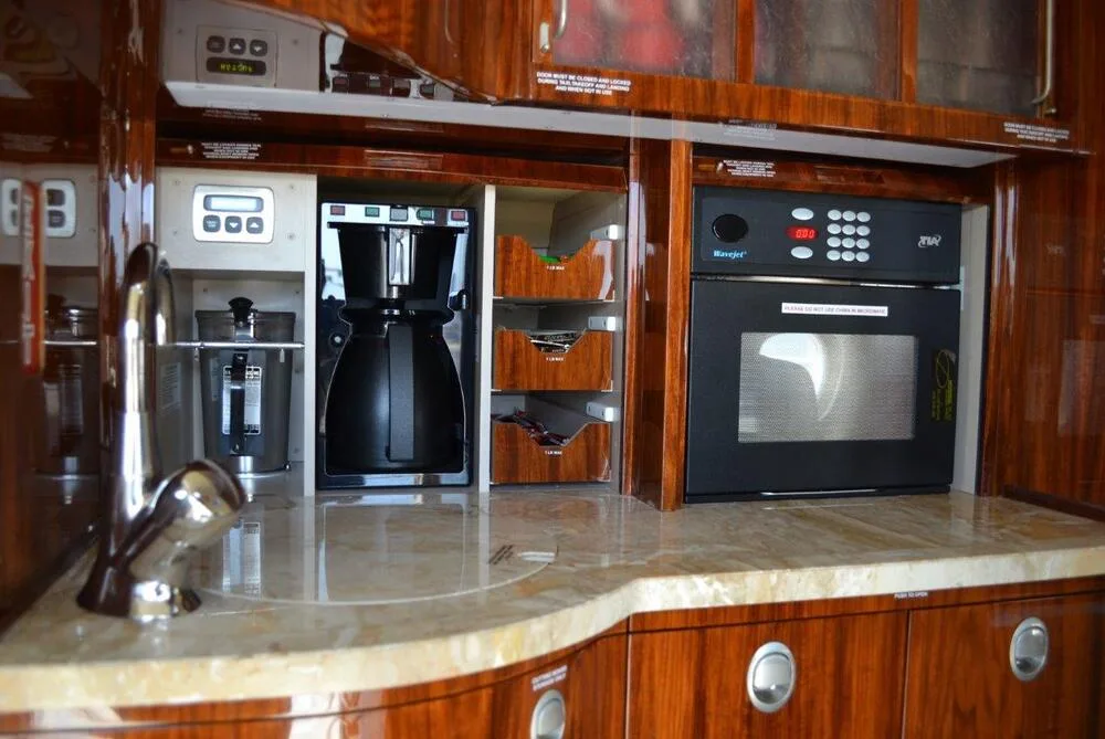 The galley area featuring coffee maker and microwave.