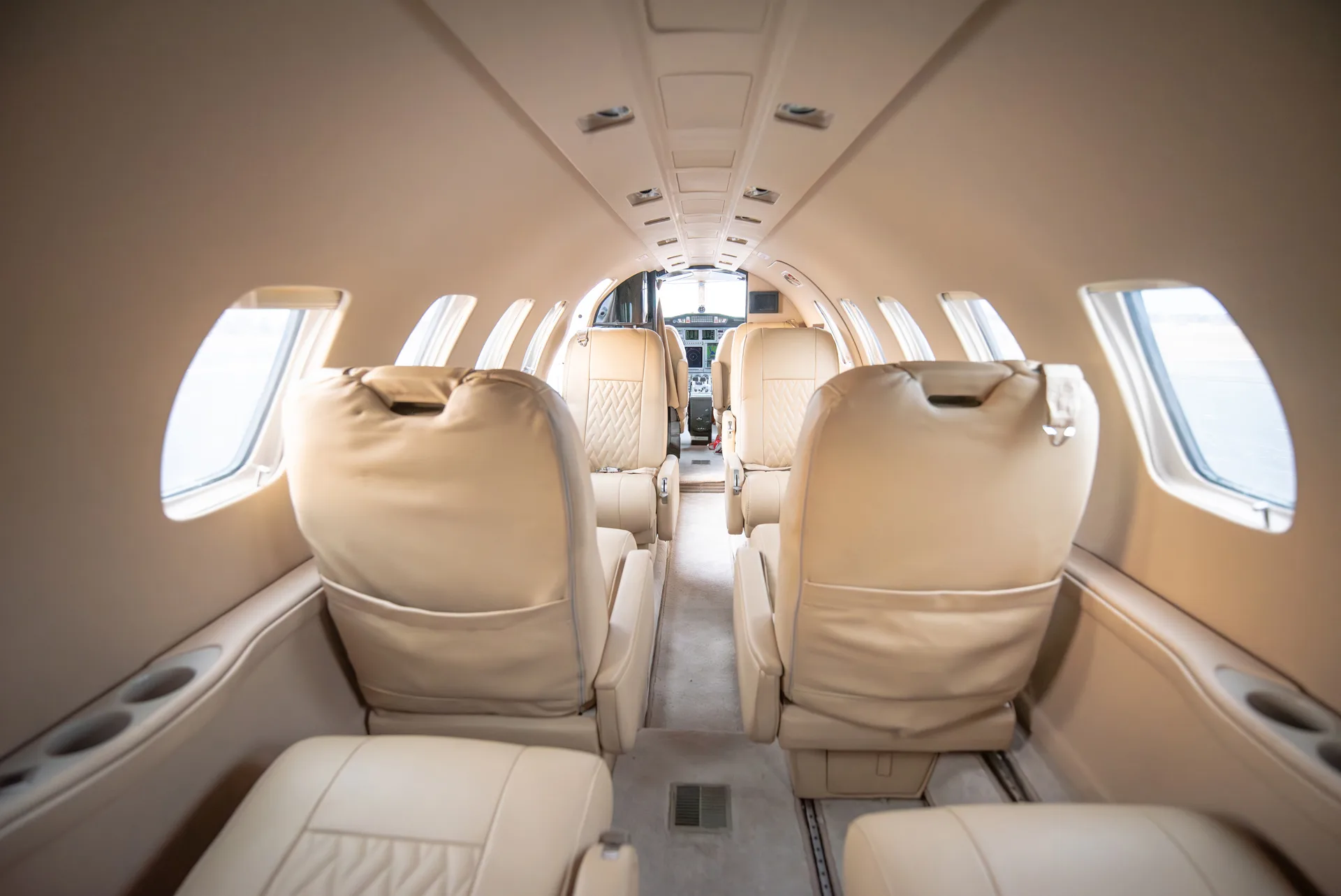 A view down the aisle of the Citation Bravo cabin, showing the seating arrangement.
