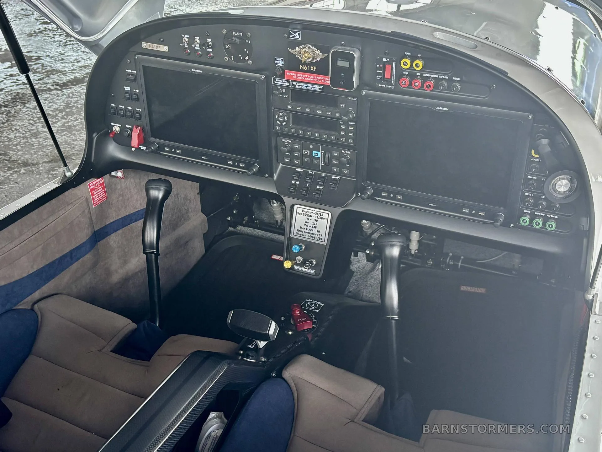 The cockpit of the Evektor Harmony Light Sport aircraft features a modern glass panel with two large displays and dual control sticks.