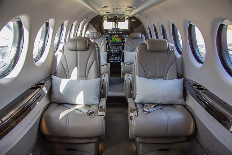 King Air cabin with leather seats and pillows.