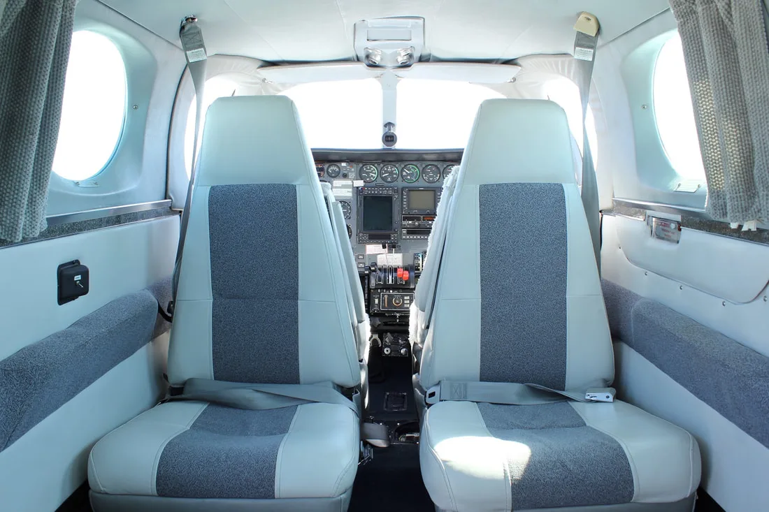 View of the cockpit from the rear seats of the aircraft.