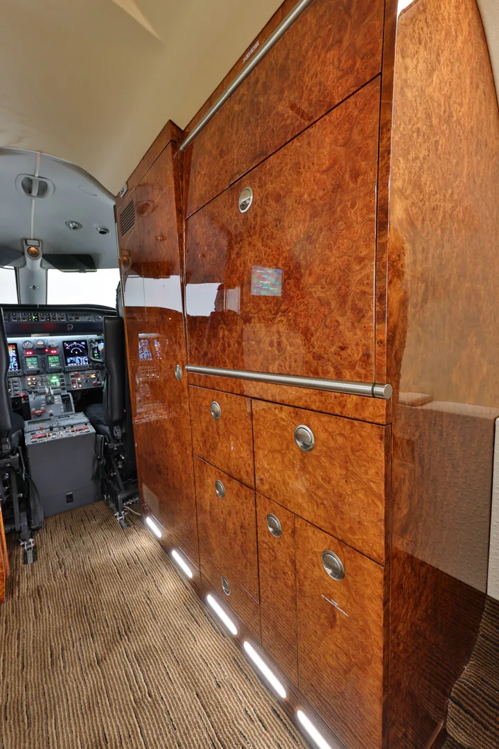 Close-up of the wood-paneled storage and cockpit.