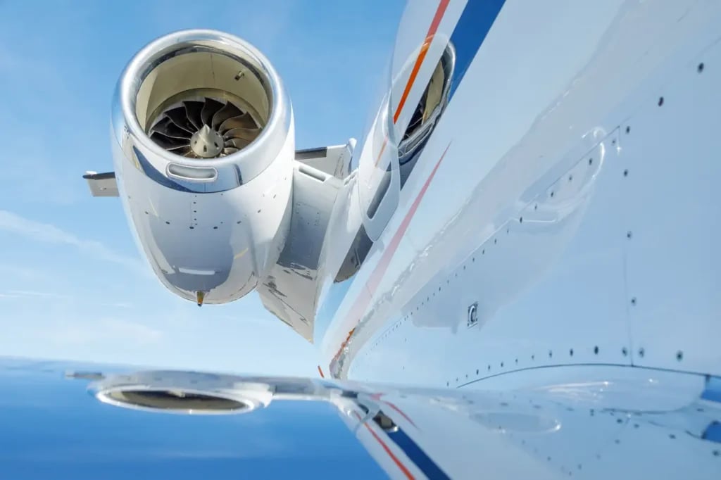 A view of the engine and wing of the aircraft in flight.