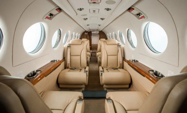 Forward view of the King Air cabin with tan leather seats.