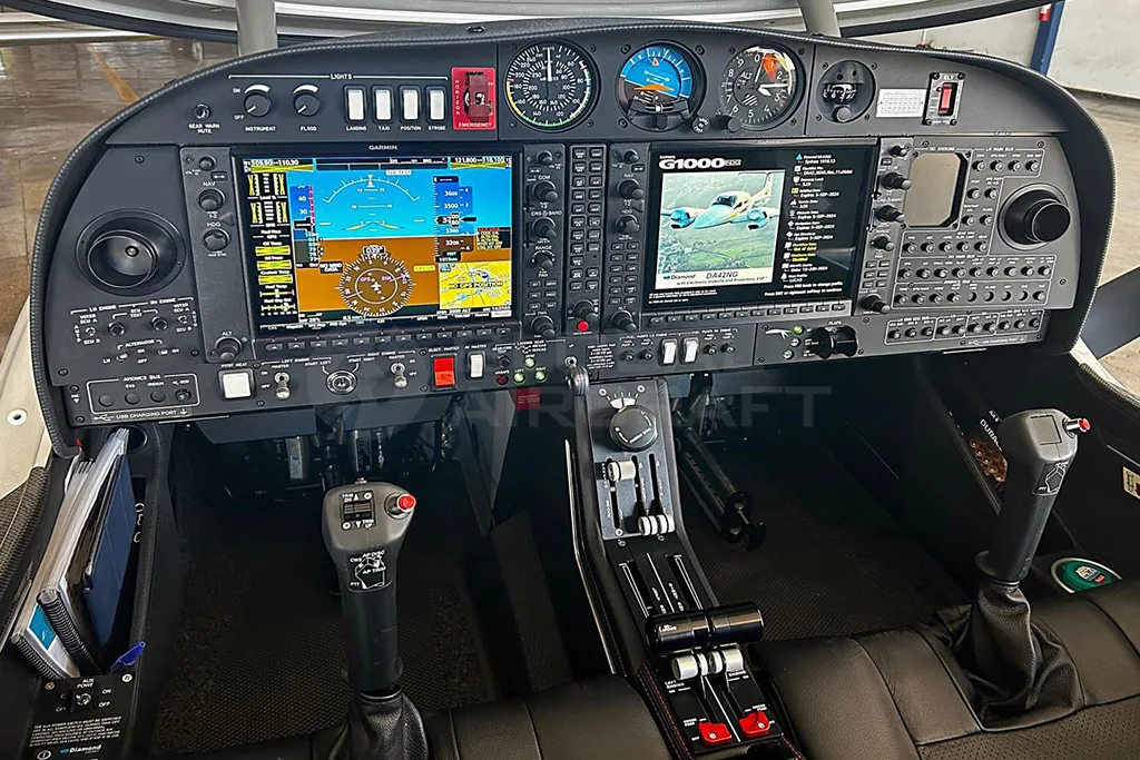 The cockpit of a Diamond DA62 aircraft featuring a modern glass panel with multiple digital displays and controls.