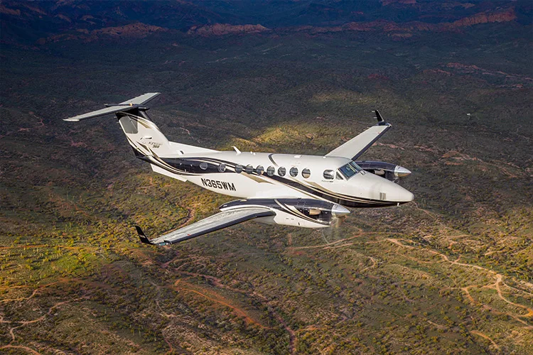 N365WM King Air in flight over a desert landscape.