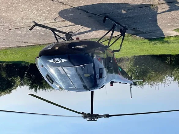 The cockpit of the 1978 ENSTROM F-28 showing controls and instruments.
