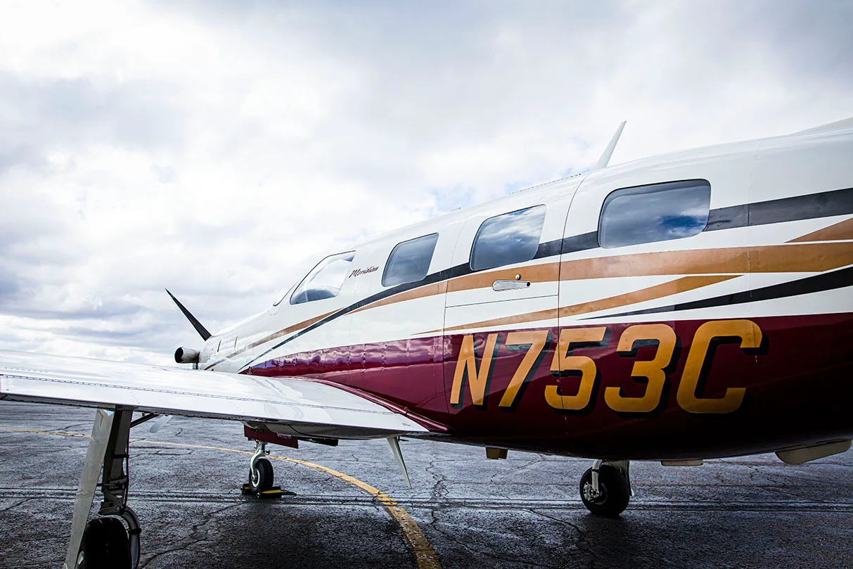 Close-up of the tail section of a Meridian aircraft with the registration number N753C.