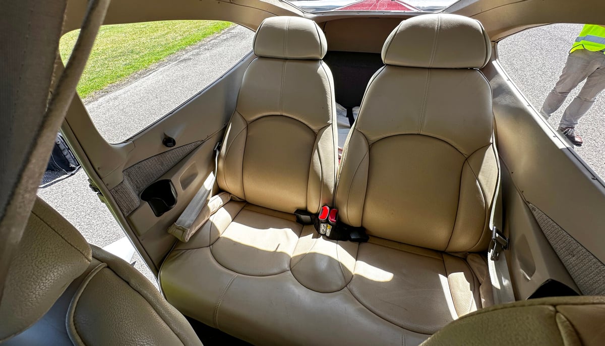 The interior of the aircraft, showing the rear seats.