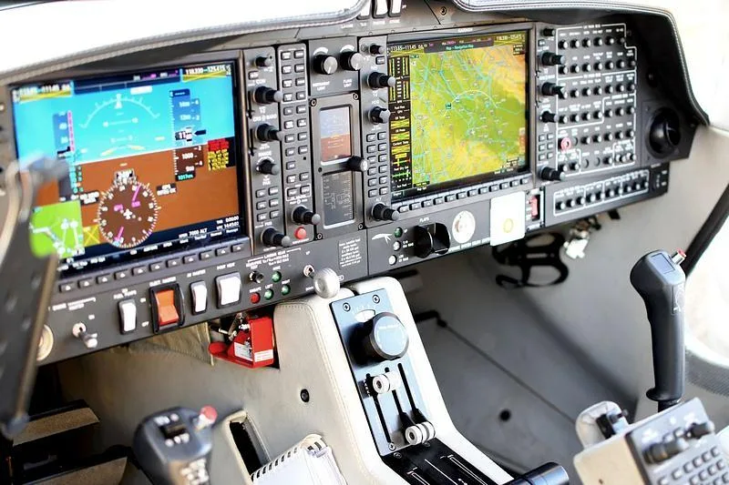 The modern glass cockpit of a Diamond aircraft, featuring multiple display screens and controls.