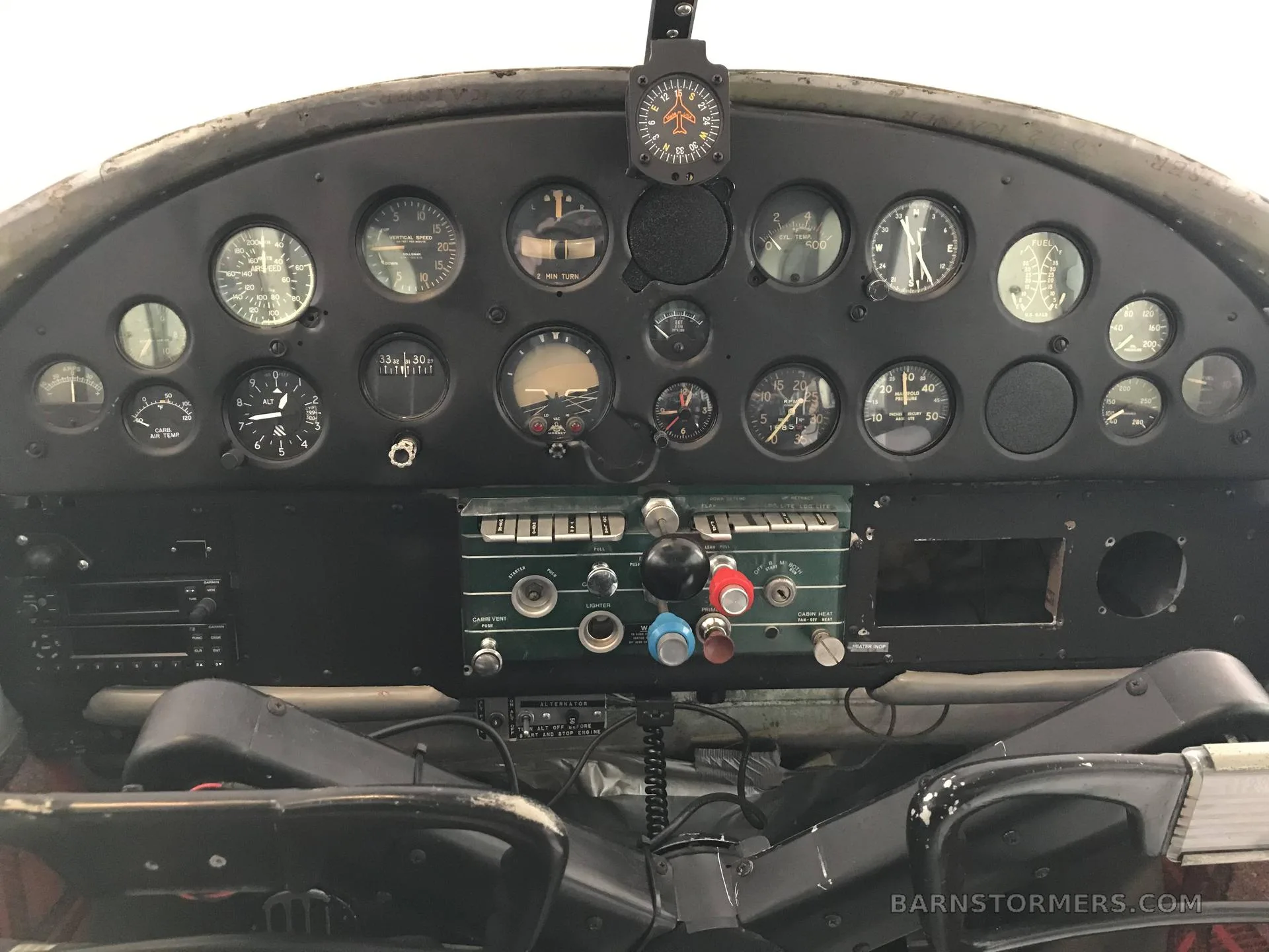 A close-up view of an aircraft's instrument panel with various gauges and controls.
