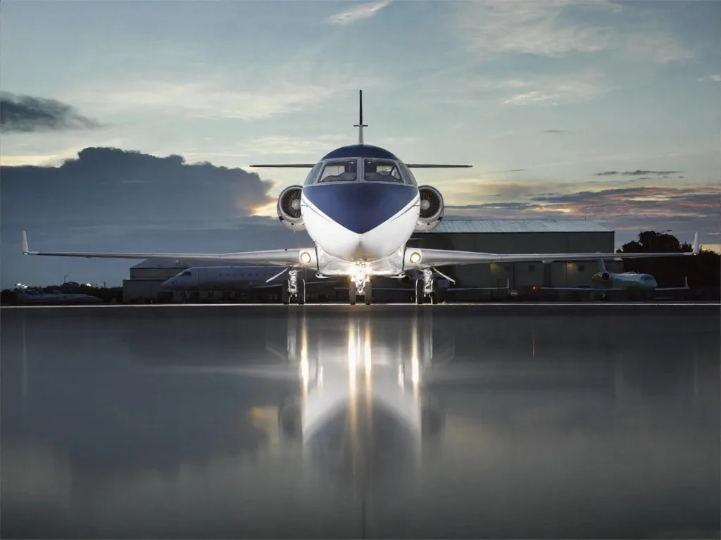 Front view of the aircraft on the tarmac with a blue and white paint scheme.