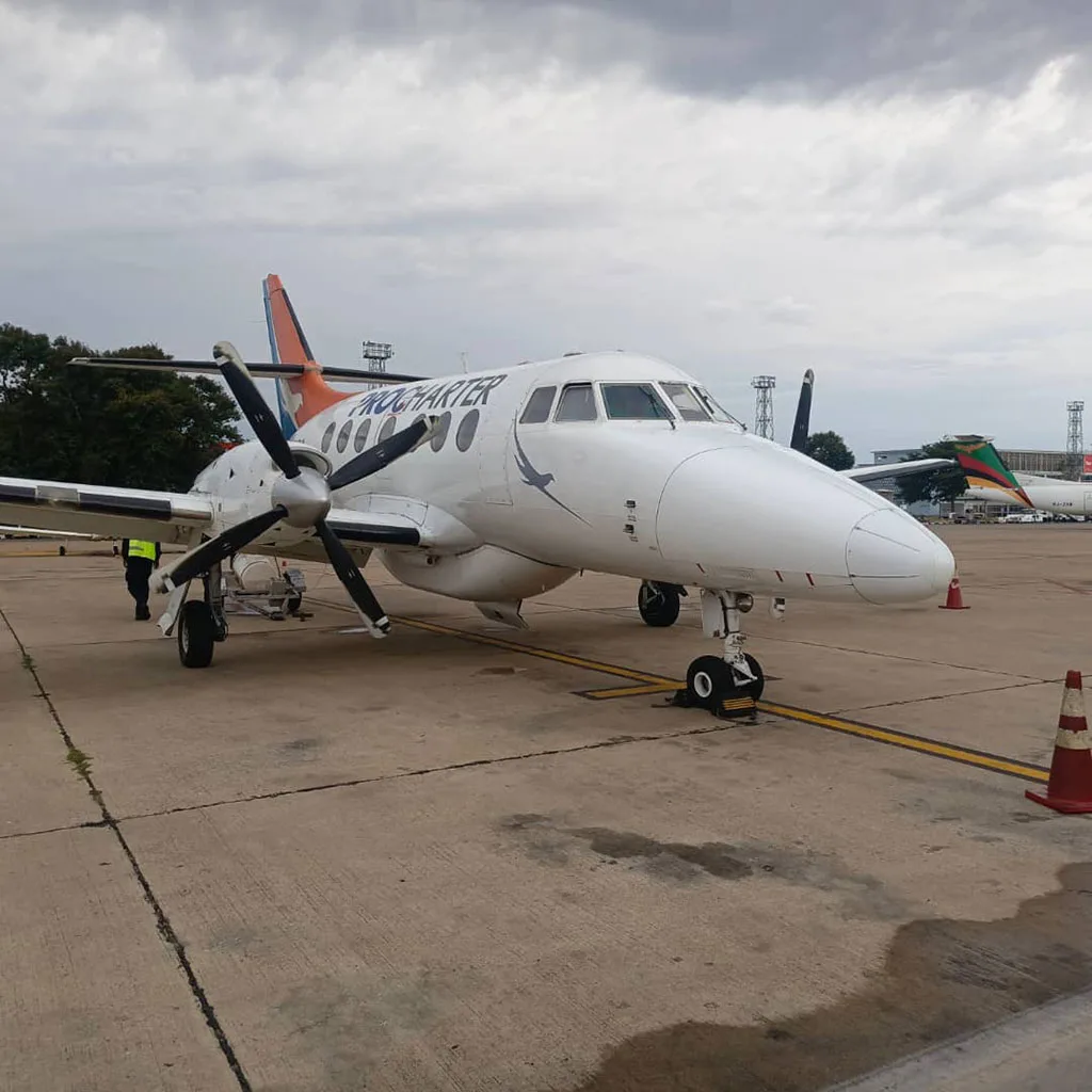 A Jetstream 32 parked at an airport.