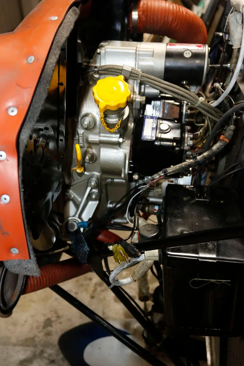 A close-up view of the aircraft engine's cylinders and associated components.