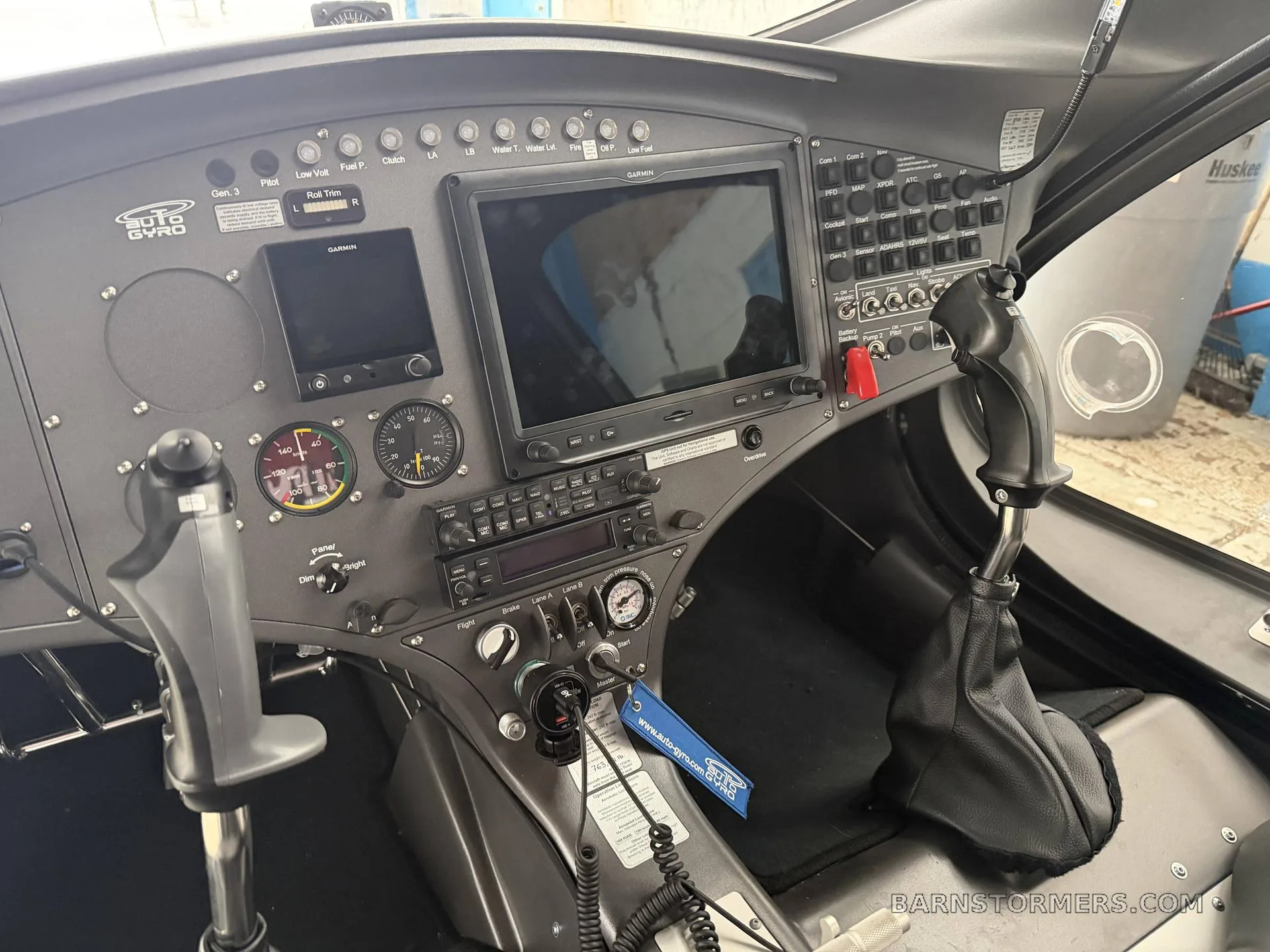 A close-up view of the AutoGyro Cavalon 915iS cockpit, focusing on the center console and instrument panel.