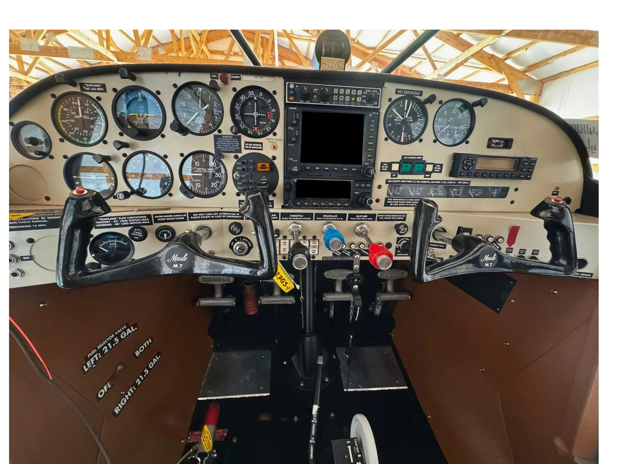 The cockpit of a Maule M7 aircraft with dual yokes and analog gauges.