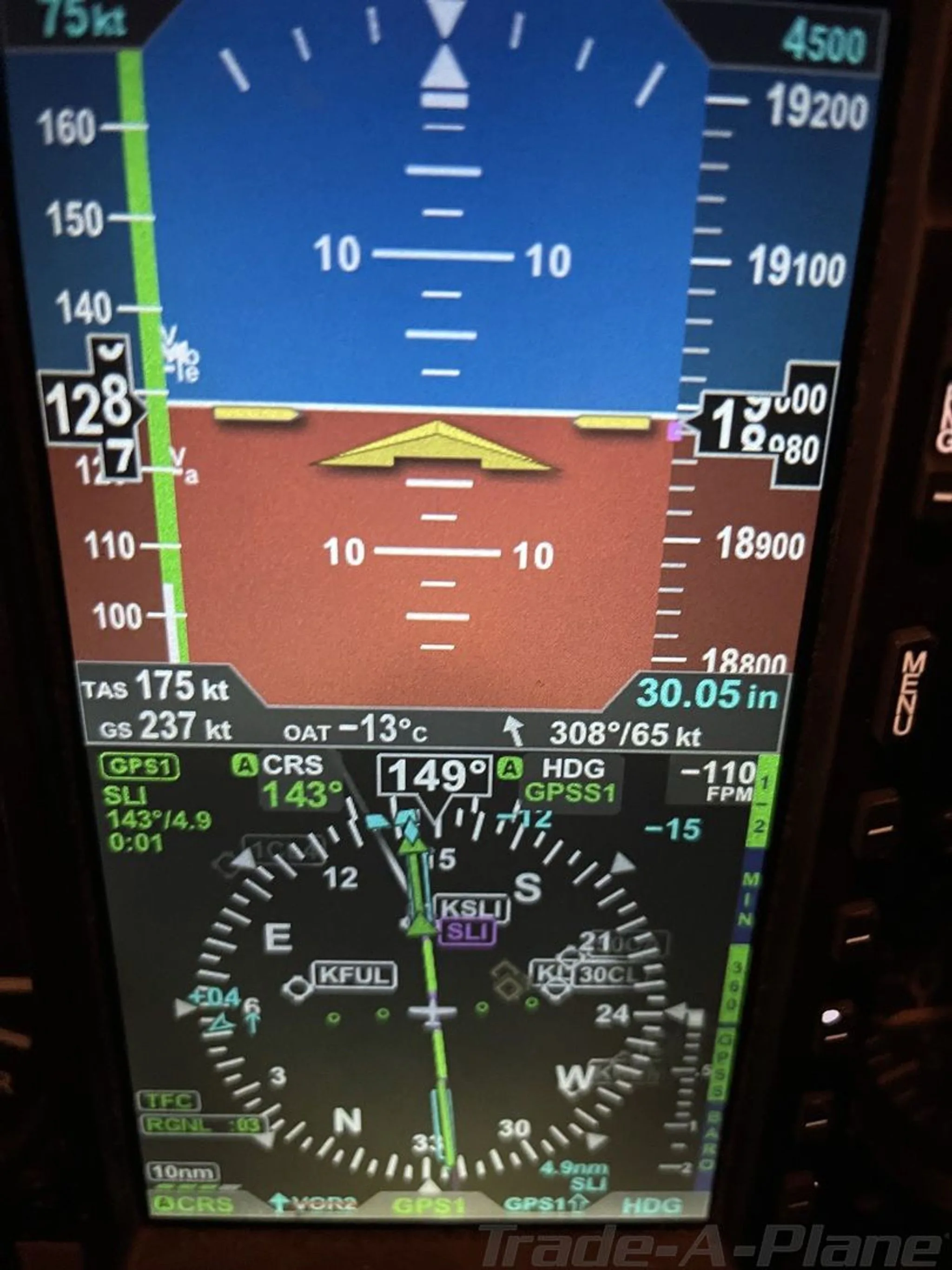 A digital primary flight display showing airspeed, altitude, heading, and other flight parameters.