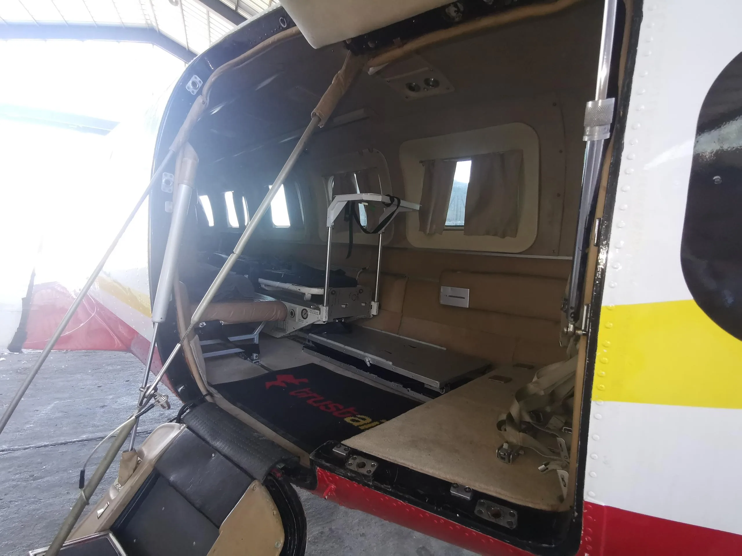Interior view of the aircraft cabin with medical equipment.