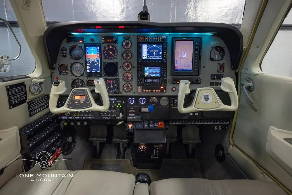The cockpit of a Beechcraft Bonanza A36, showing the instrument panel with multiple displays and controls.