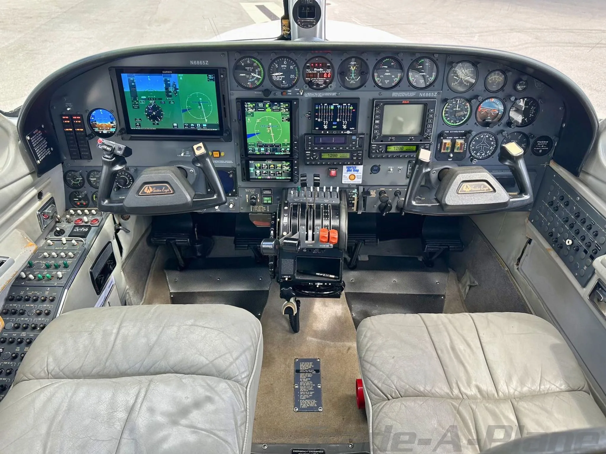 The cockpit of the Cessna 421C showing the instrument panel.
