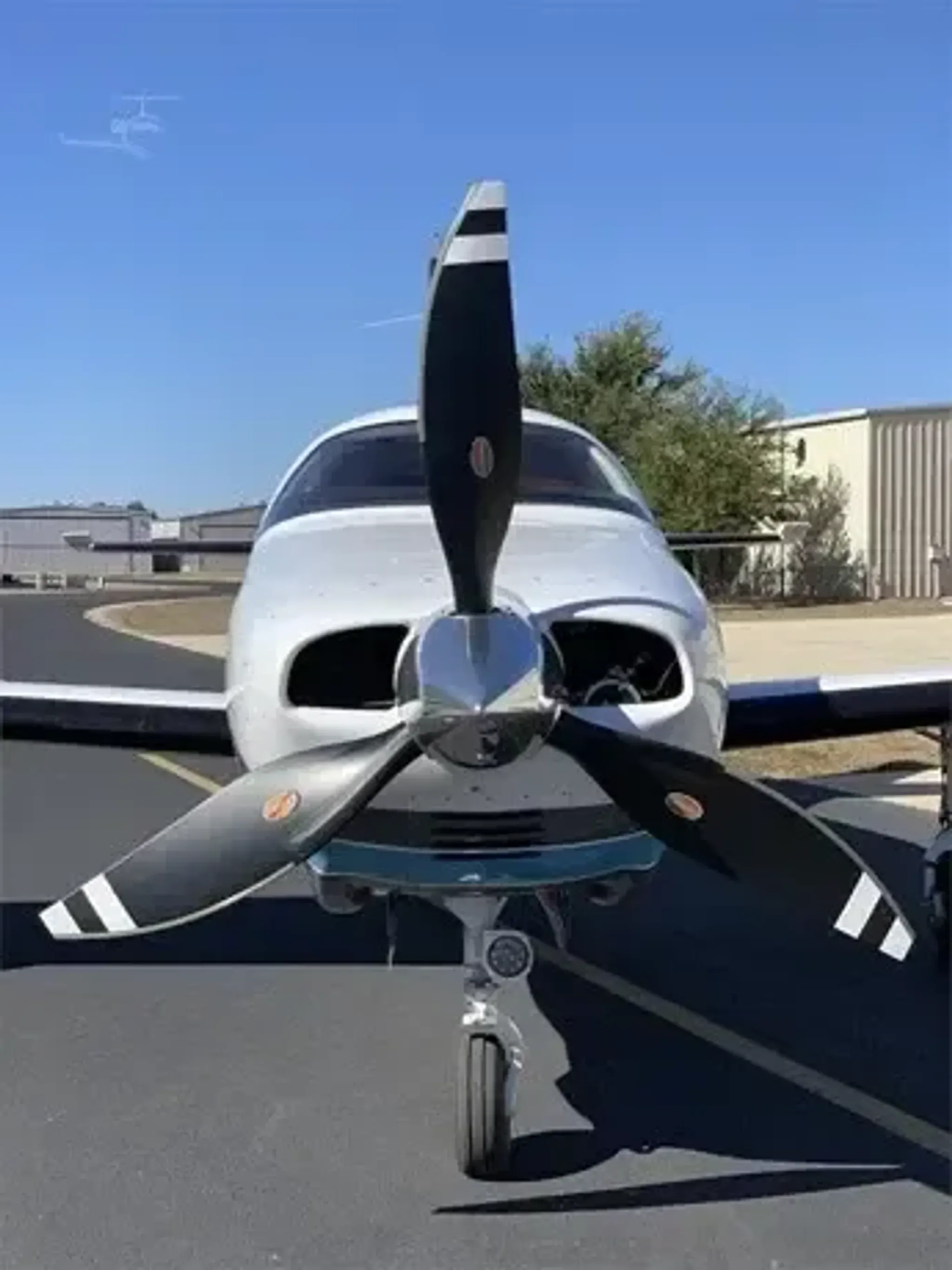 A close-up view of the aircraft's front with the propeller visible.
