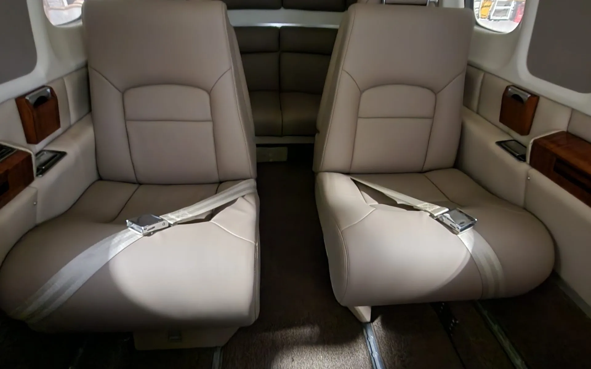 The interior of the Commando aircraft features tan leather seats.