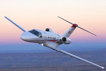 A Citation CJ4 aircraft in flight.