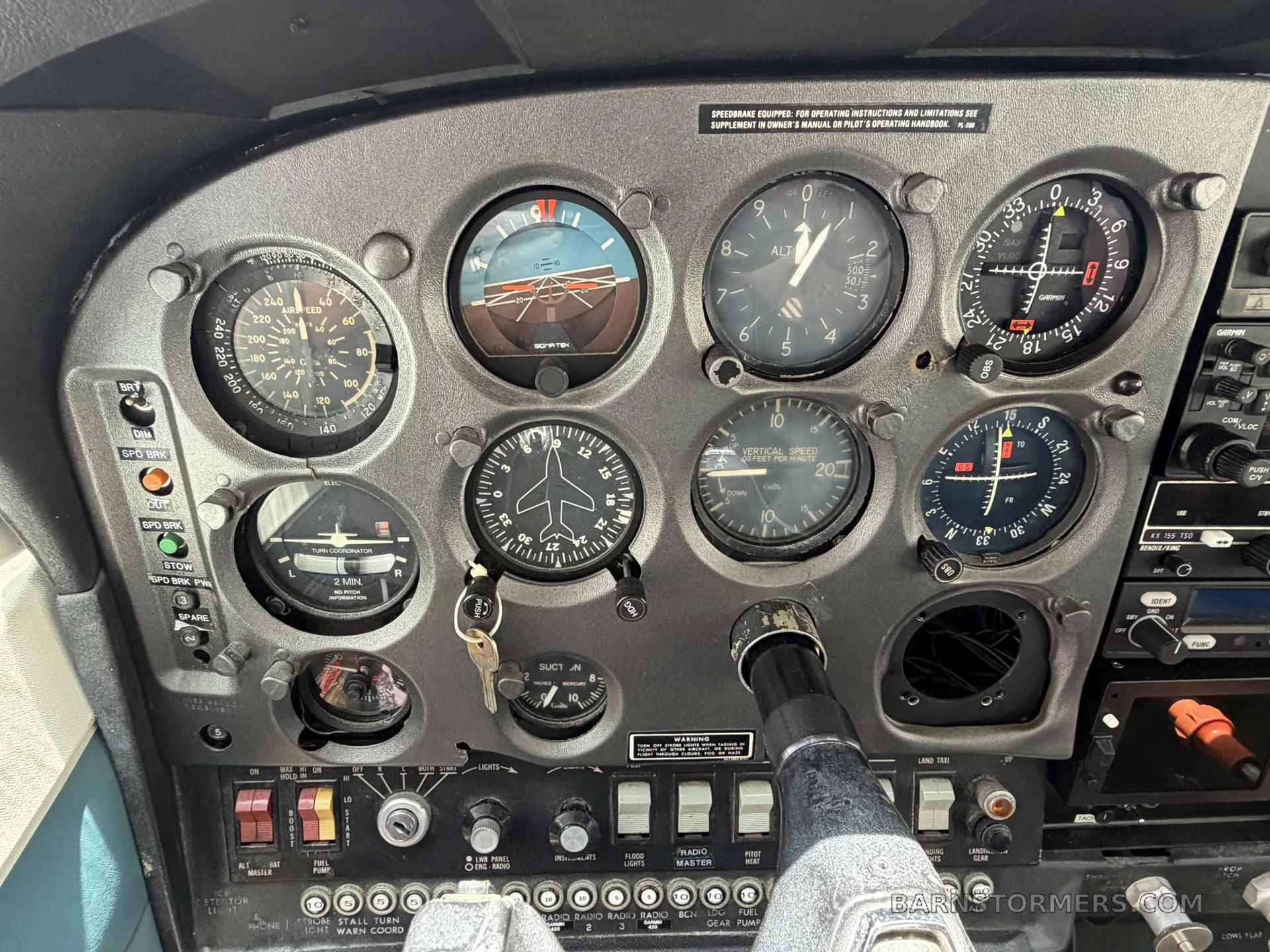 A close-up view of an aircraft's instrument panel, showing various gauges and controls.