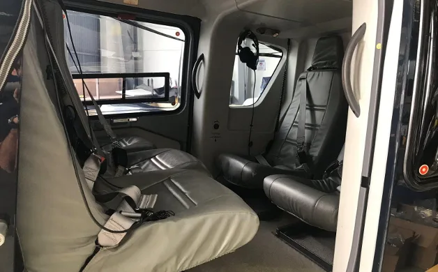 View of the helicopter's interior cabin with seats.