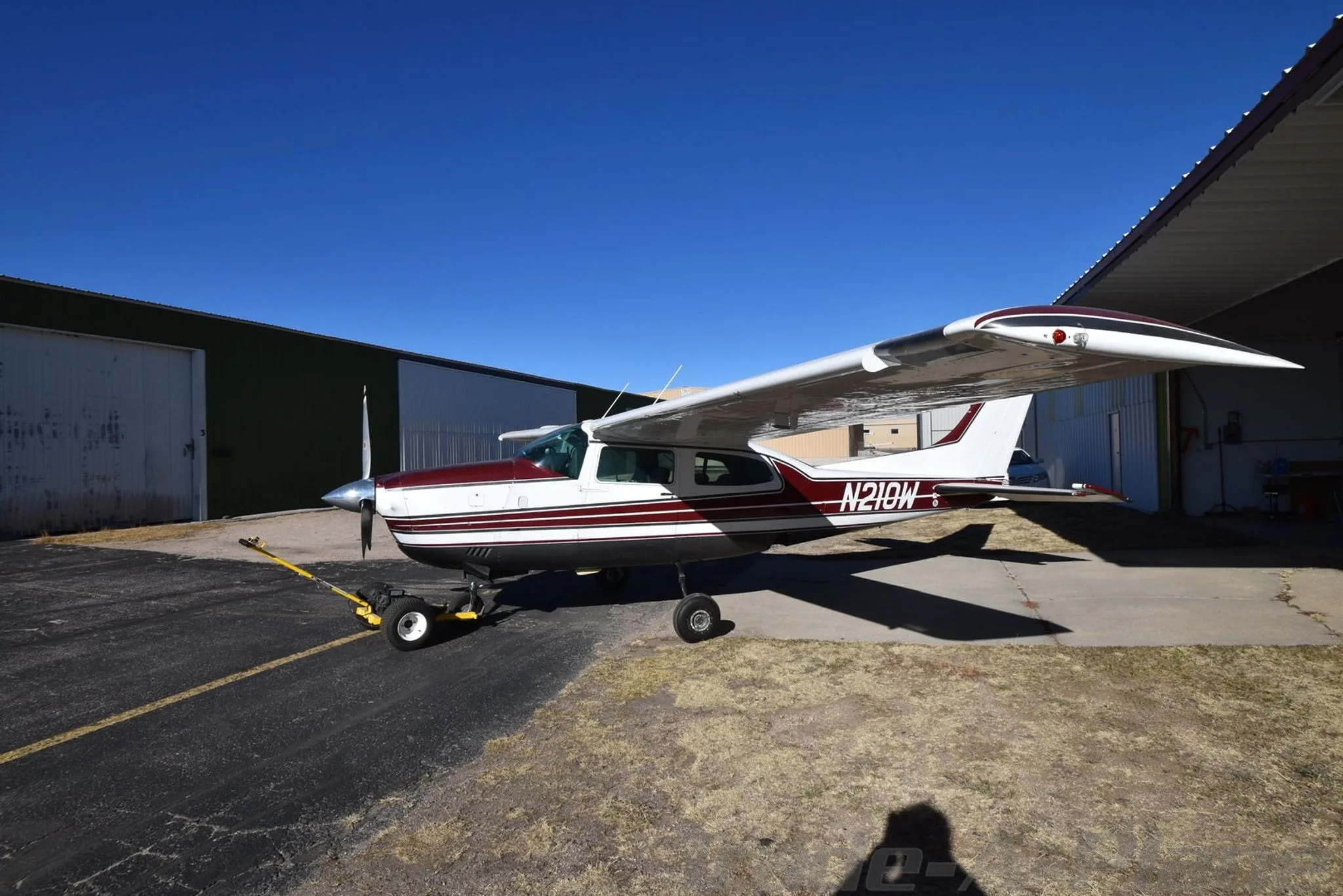 Another angle of the Cessna 210K at the hangar.