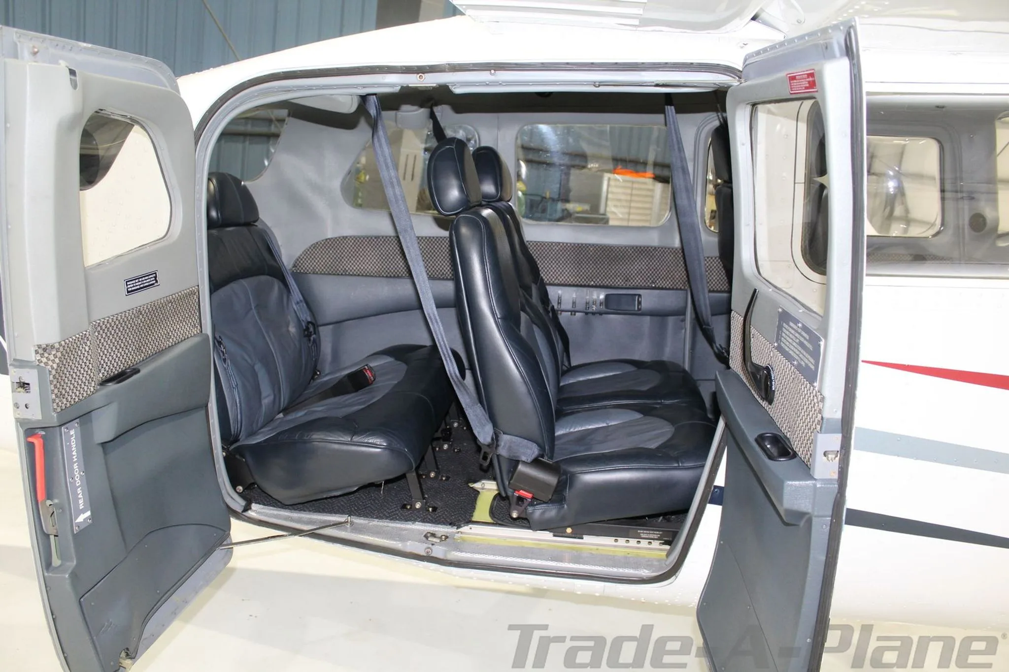 Interior view showing the cabin seating of the Cessna 206H.