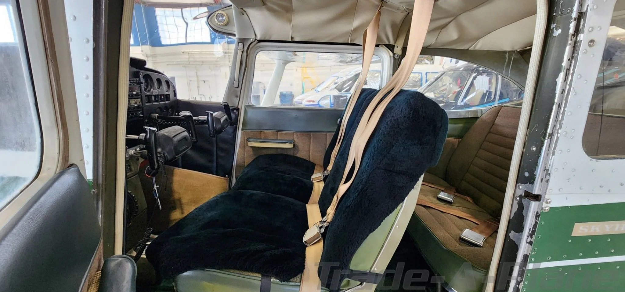 The interior cabin of the Cessna 172 with seats.