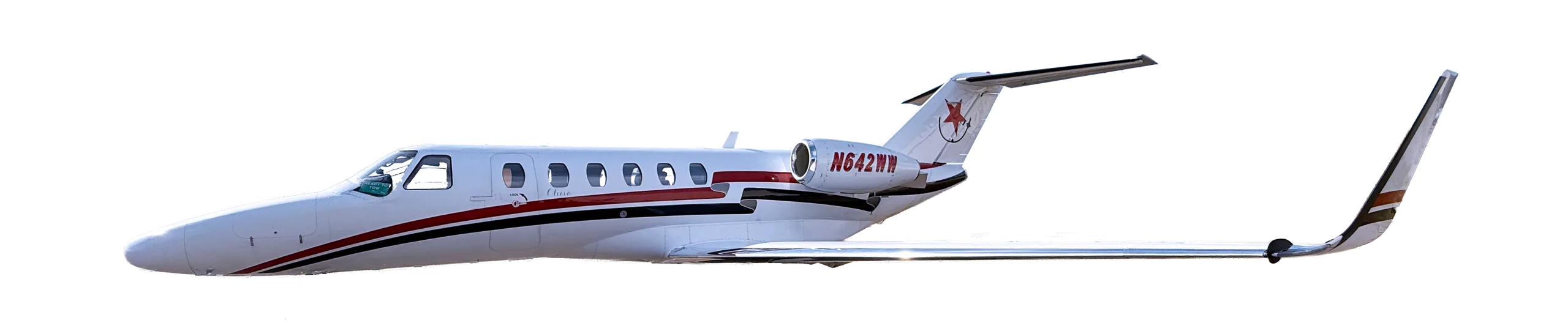 Side view of a white jet aircraft with red accents, registration N642WM.