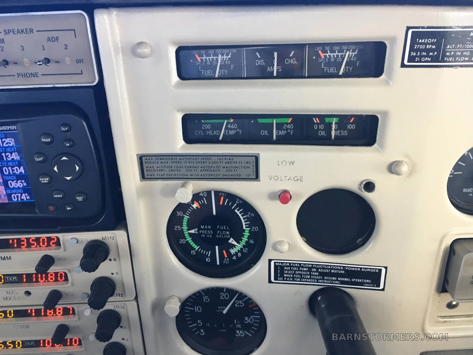 A close-up view of an aircraft's instrument panel, showing various gauges and avionics.
