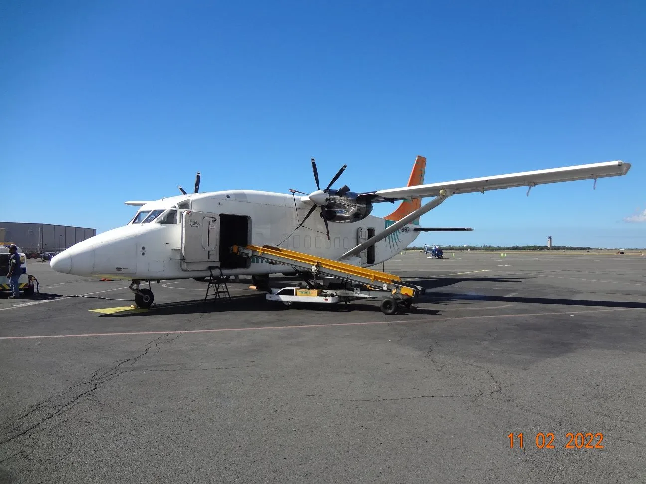 A de Havilland Canada DHC-6 Twin Otter with Transair livery on the ramp.