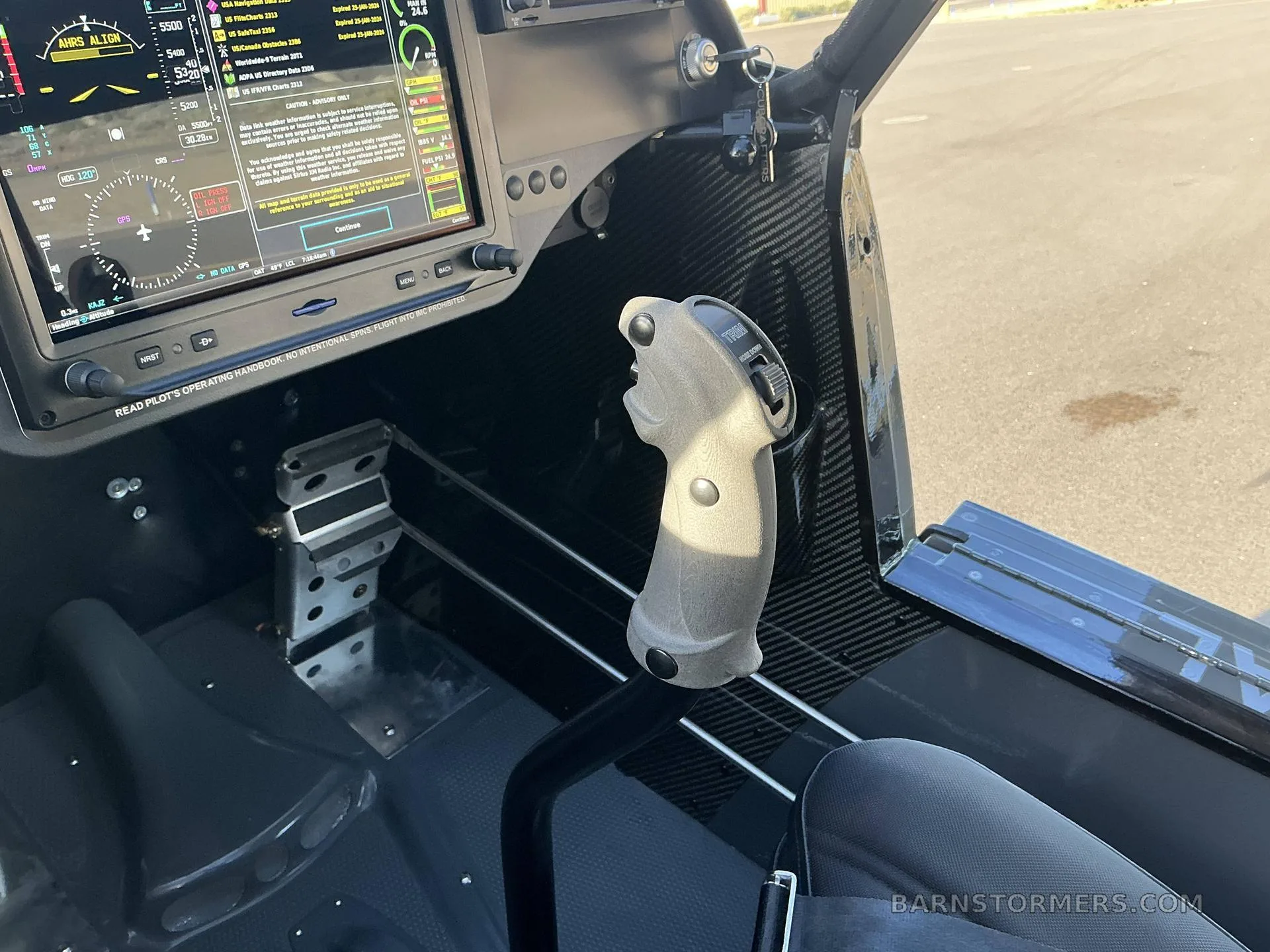A close-up view of the stick and rudder pedals in the cockpit of a Carbon Cub FX3.