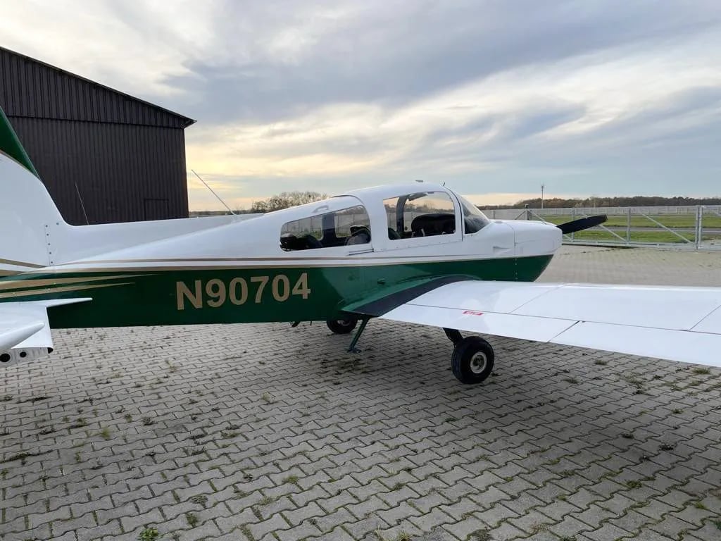 Side view of N90704 aircraft with registration number visible.