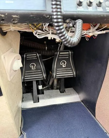 A close-up view of the rudder pedals in the cockpit of the Beechcraft Sundowner N37240.