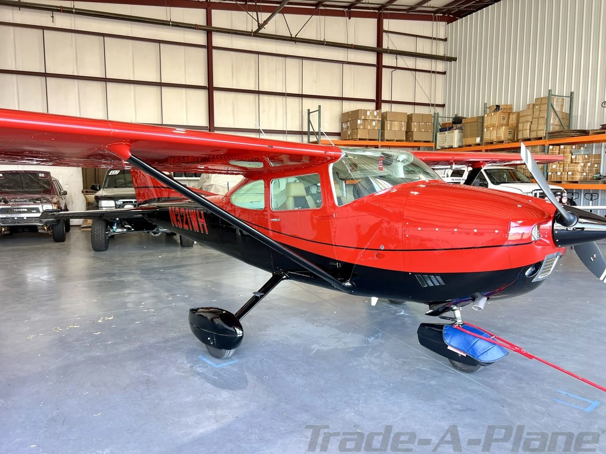 Another angle of the Cessna 182Q Skylane showcasing its vibrant colors.